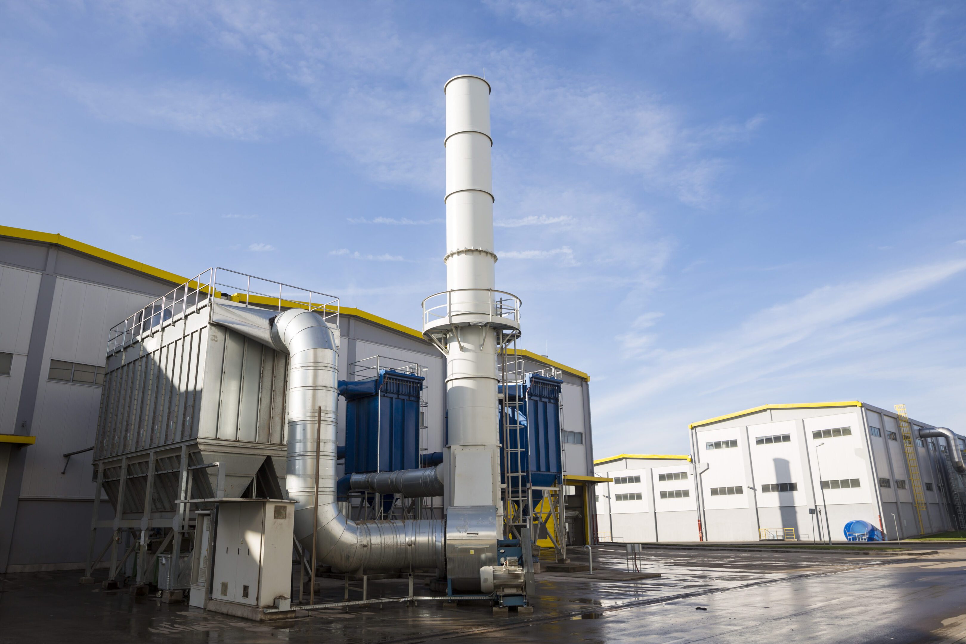 Waste-to-energy facility outside New modern industrial waste plant from the outside. Waste-to-energy plant. Produces electricity and heat directly through combustion. Produces a combustible fuel commodity, such as methane, methanol, ethanol and synthetic fuels.